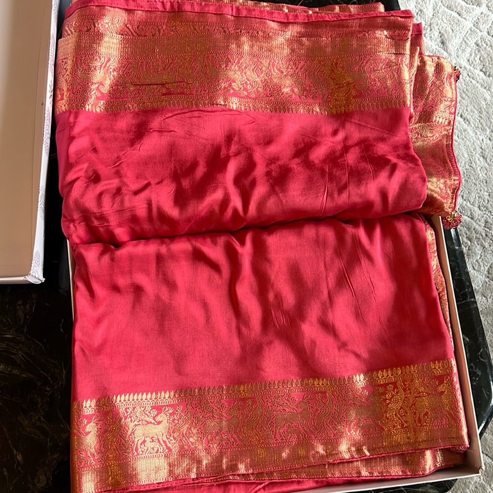 Never worn saree, poly silk type material with gold deer and birds for border